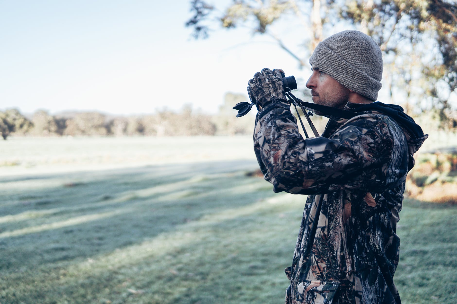 man holding binoculars