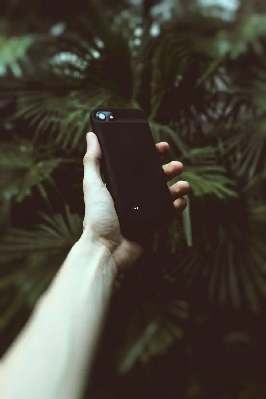 person holding black android smartphone