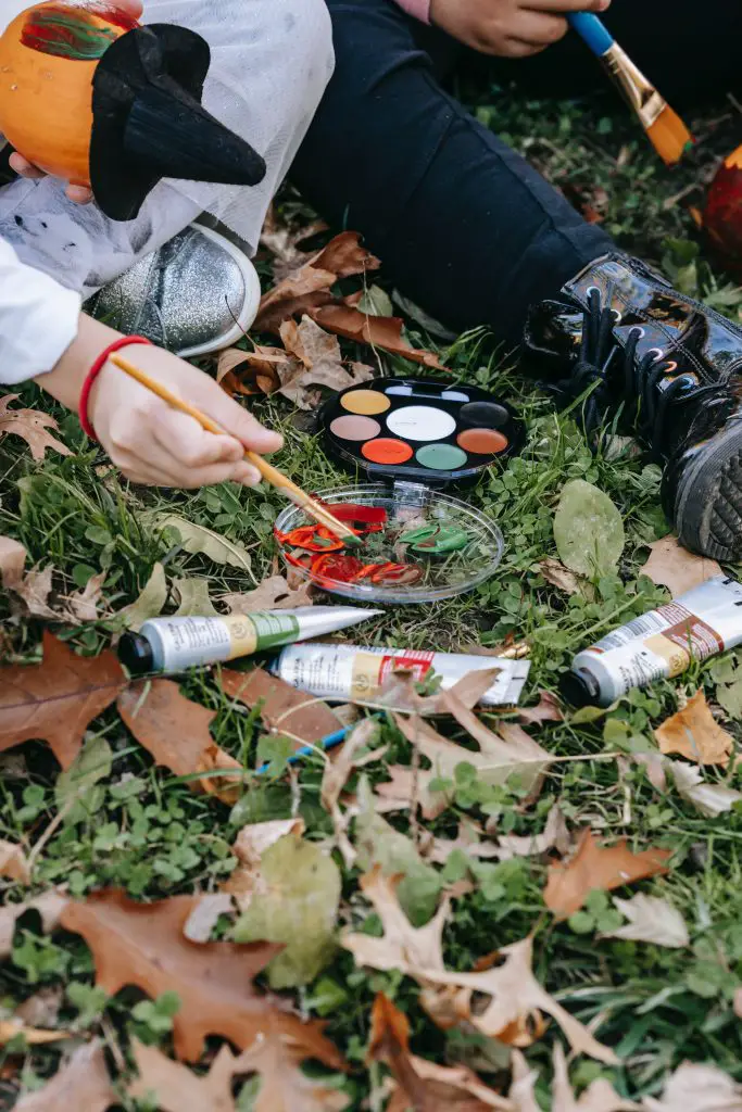 Outdoor Halloween activity painting pumpkins