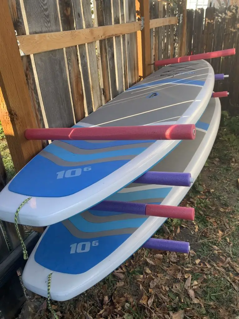 Store your standup paddleboard for winter off of the ground using rebar, pvc, and pool noodles.