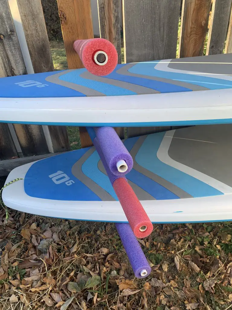 Store your standup paddleboard for winter off of the ground using rebar, pvc, and pool noodles.