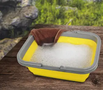 Wash dishes in a dish basin is basic camping etiquette