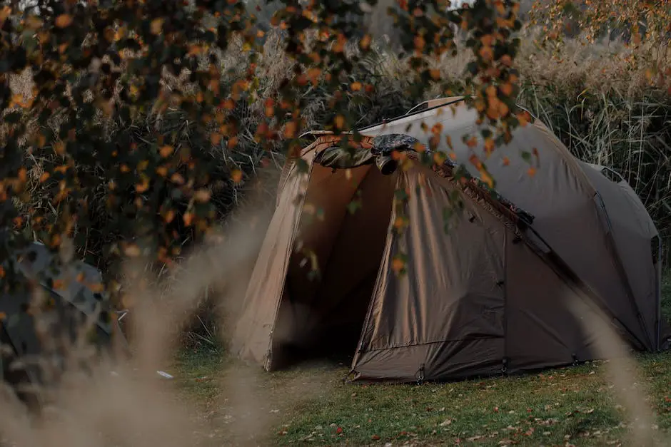 A person cleaning a tent to properly maintain it during the fall camping season
