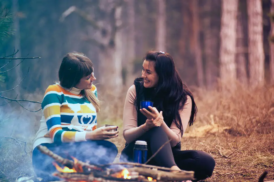 A group of people sitting around a campfire and enjoying a meal in the wilderness Plan-and-Pack