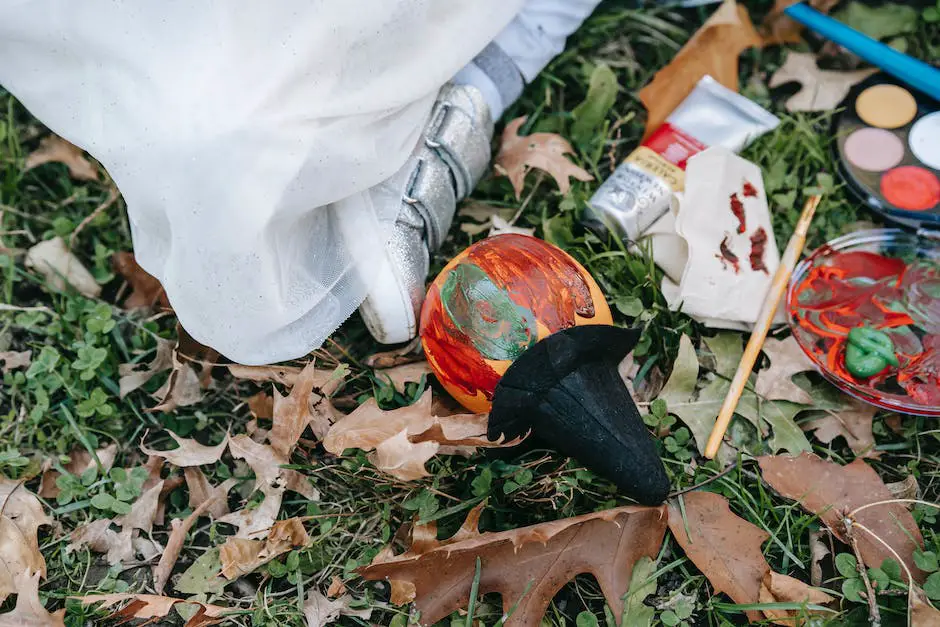 Children creating fall leaf art, surrounded by colorful leaves on the ground Family-Friendly Fall Camping Activities